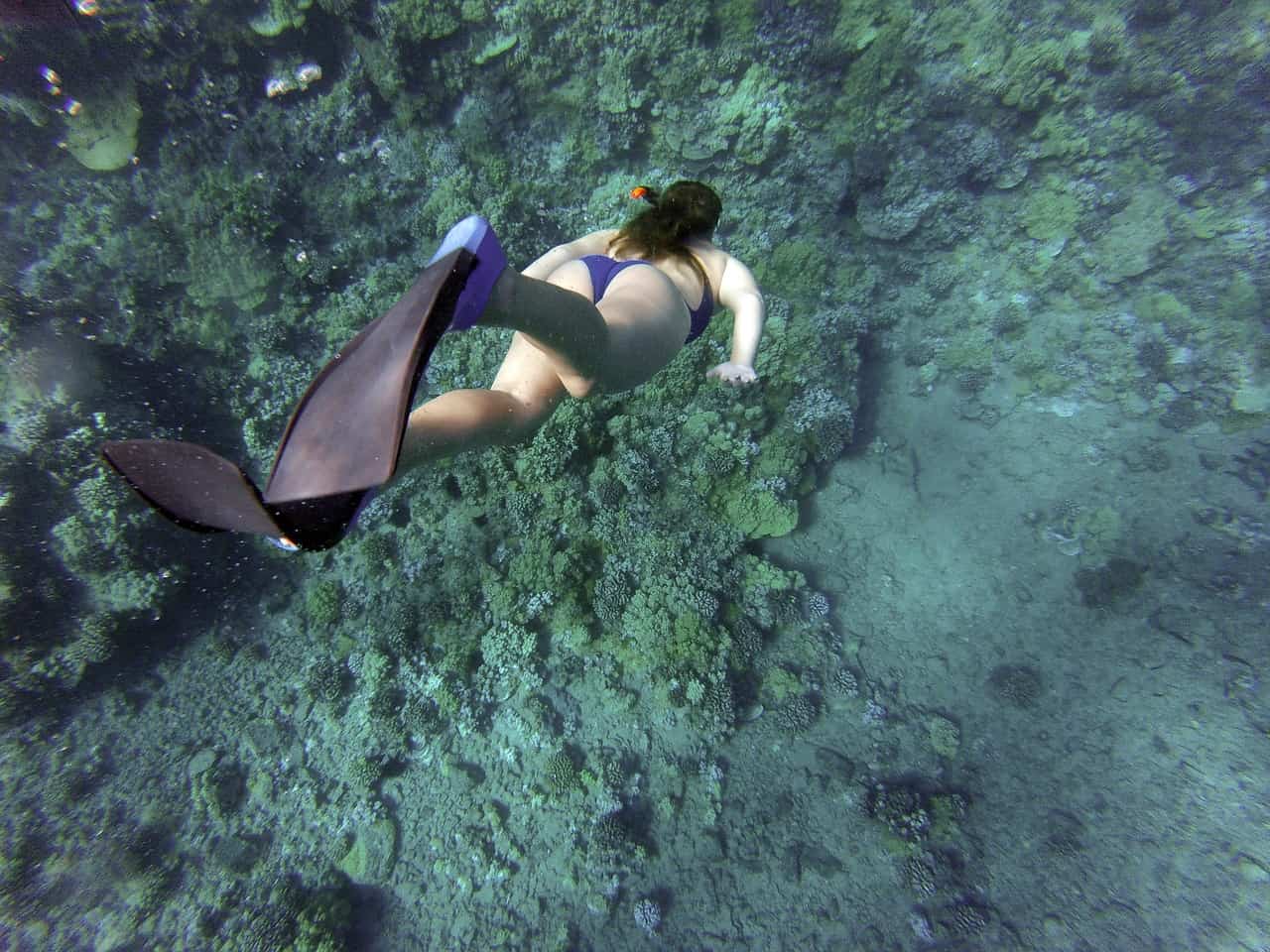 Woman on blue bikini swimming