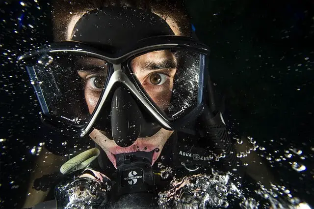 a person wearing scuba mask while underwater